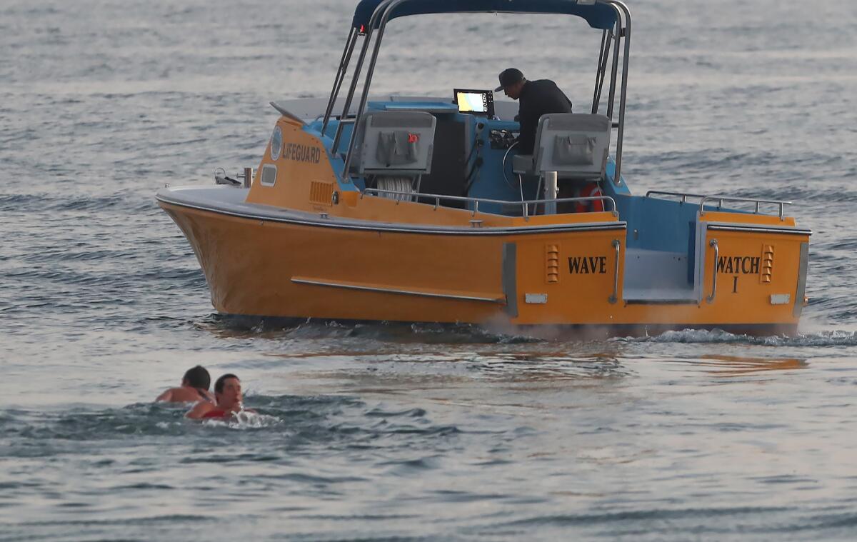 Lifeguards from the marine safety department perform a mock rescue from the Wave Watch rescue vessel in Laguna Beach.