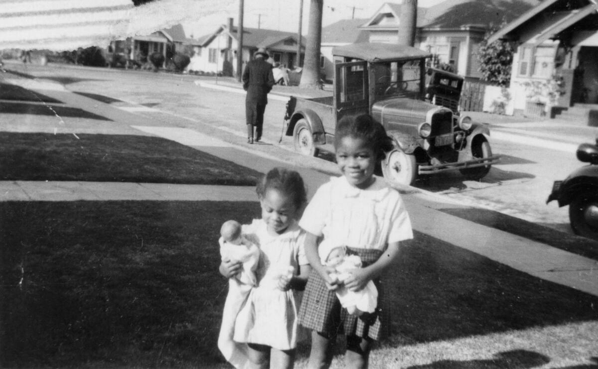 Margaret Ellis, left, and sister Eleanor are photographed in Boyle Heights circa 1943.