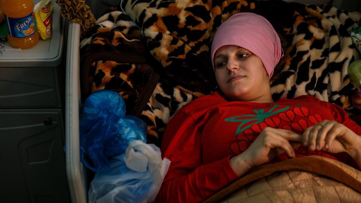 Suhaida Hussein, 19, is treated in an Irbil hospital on March 17. Her first thought after the attack was for her pregnancy.