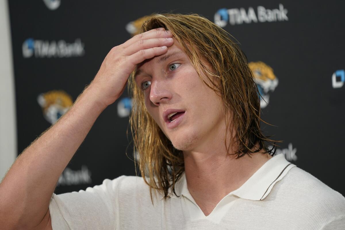 Jacksonville Jaguars quarterback Trevor Lawrence (16) speaking to members of the media following the end of an NFL football game against the Washington Commanders, Sunday, Sept. 11, 2022, in Landover, Md. Washington won 28-22. (AP Photo/Patrick Semansky)