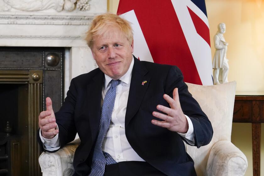 Britain's Prime Minister Boris Johnson gestures as he meets Estonia's Prime Minister Kaja Kallas at 10 Downing Street, London, Monday, June 6, 2022. (AP Photo/Alberto Pezzali, Pool)