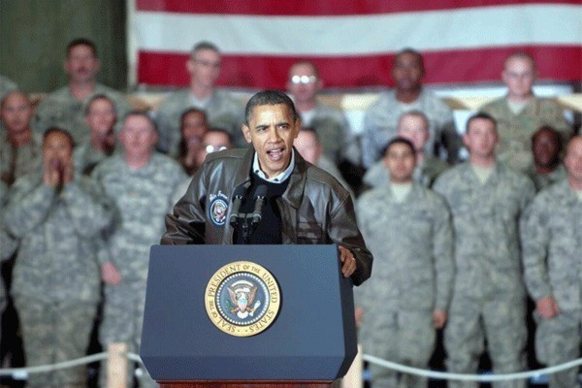 President Obama is seen waving to U.S. soldiers during a surprise visit to Afghanistan in Dec. 2010.