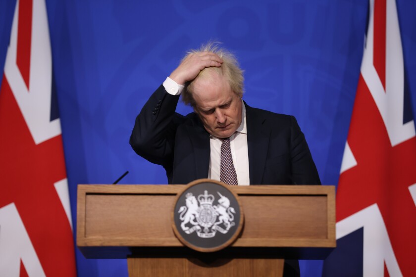 Britain's Prime Minister Boris Johnson speaks during a press conference in London, Saturday Nov. 27, 2021, after cases of the new COVID-19 variant were confirmed in the UK. (Hollie Adams/Pool via AP)