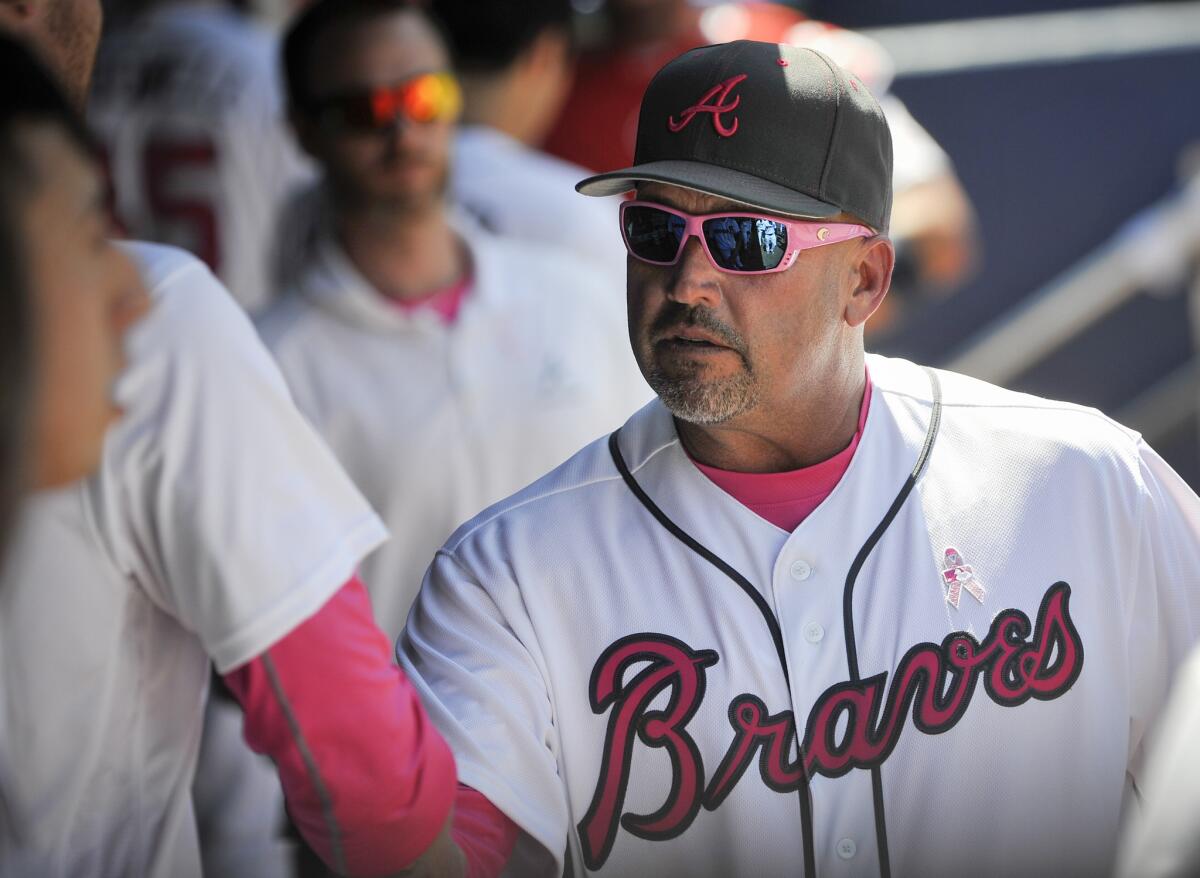Fredi Gonzalez talks with Atlanta Braves players during a game against Arizona on May 8.