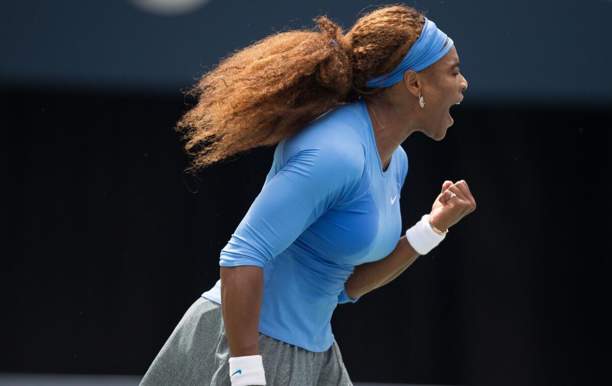 Serena Williams reacts after earning a point against Sorana Cirstea in the Rogers Cup women's championship match on Sunday in Toronto.