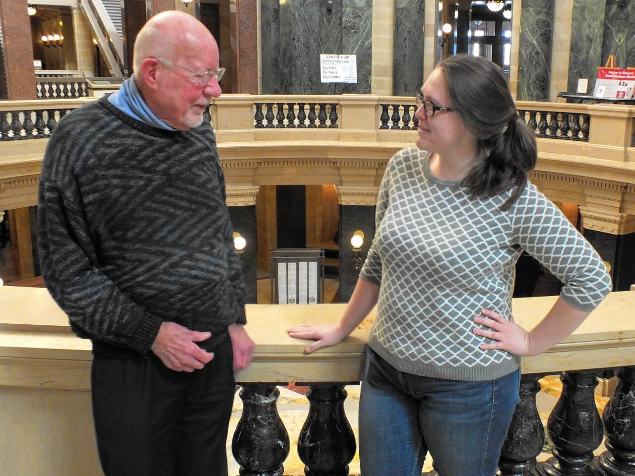 State Sen. Fred Risser (D-Madison) chats with aide Cassie Jurenci inside the Wisconsin State Capitol, where he has served as a legislator for six decades.