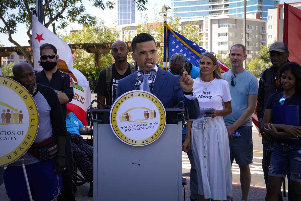 Shane Harris joined by homeless advocates Friday morning in a call for the creation of a city Homeless Commission.