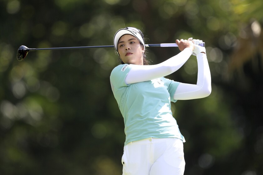 Patty Tavatanakit of Thailand plays a shot from the fifth tee during her first round at the Women's World Championship of golf at Sentosa Golf Club in Singapore, Thursday, March 3, 2022. (AP Photo/Paul Miller)