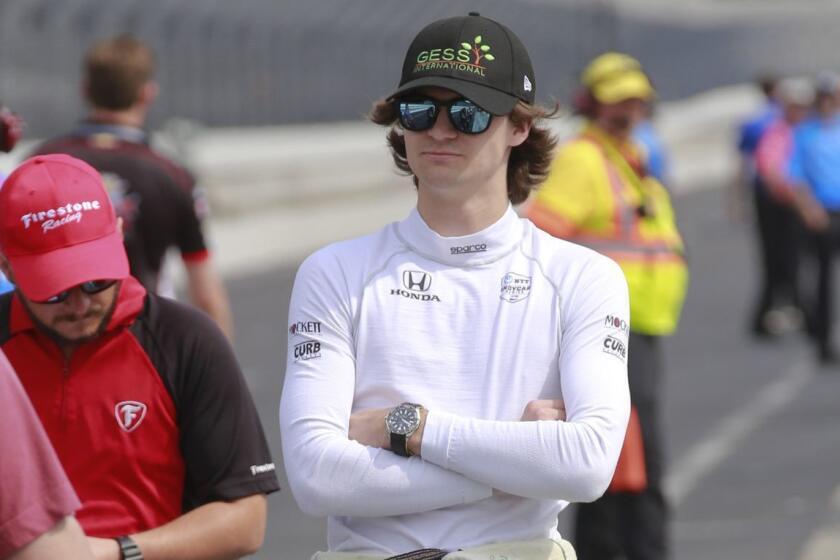 Colton Herta waits in the pit area for the start of the final practice session for the Indianapolis 500 IndyCar auto race at Indianapolis Motor Speedway, Friday, May 24, 2019, in Indianapolis. (AP Photo/R Brent Smith)