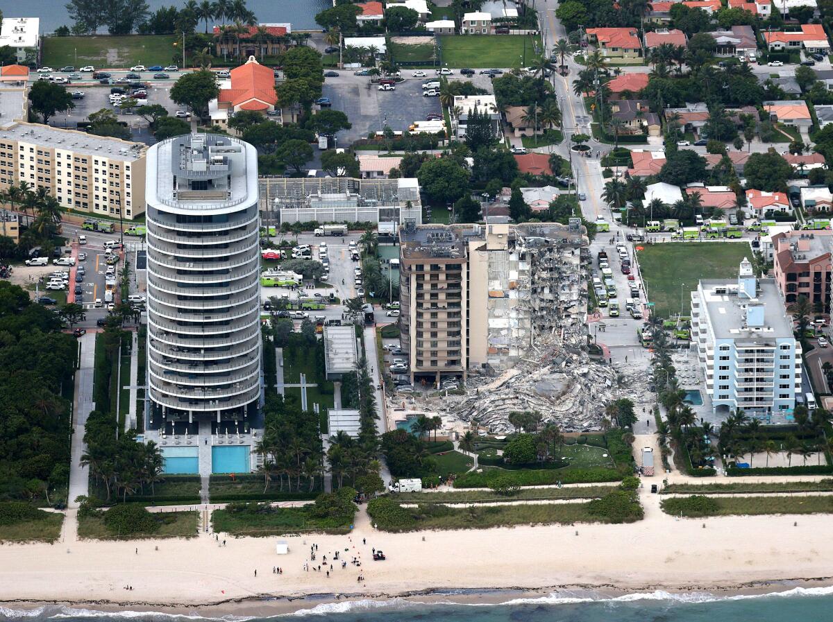 An aerial view of the beach area including the collapsed building.