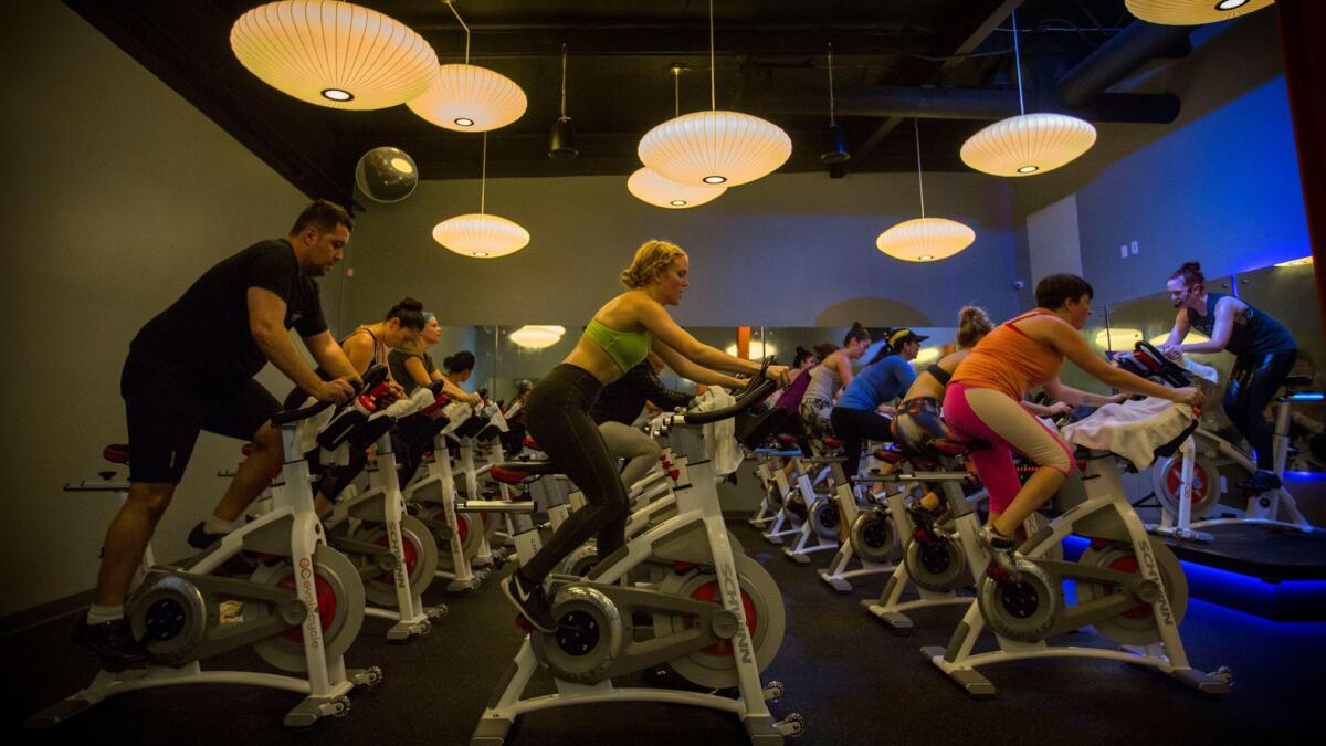 Instructor Stacy Noelle Conner leads the EvolvRide at EvolvCycle, a modern spin studio in Studio City.