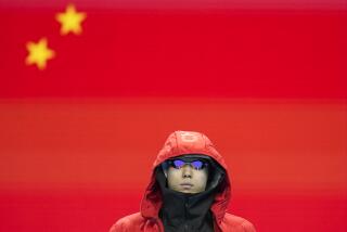 Qin Haiyang, of China, before competing in the men's 100-meter breaststroke semifinal.