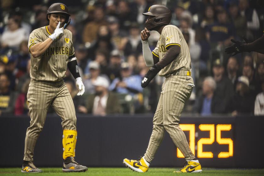 MILWAUKEE, WISCONSIN - APRIL 16: Ha-Seong Kim #7 of the San Diego Padres celebrates his home run with Jurickson Profar #10 in the first inning against the Milwaukee Brewers at American Family Field on April 16, 2024 in Milwaukee, Wisconsin. (Photo by Matt Thomas/San Diego Padres/Getty Images)