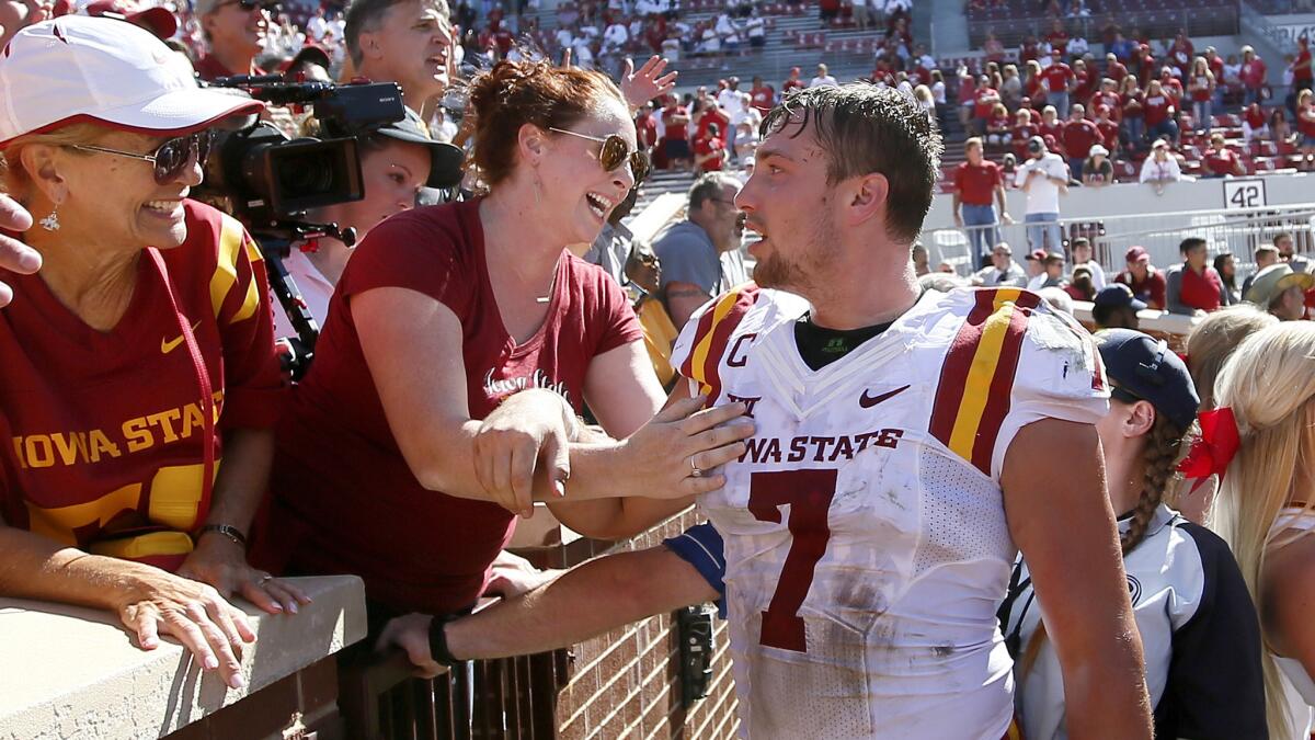 Iowa State's Joel Lanning celebrates with his sister, Jenna Lanning, left, following Saturday's game against No. 3 Oklahoma. Iowa State won 38-31.