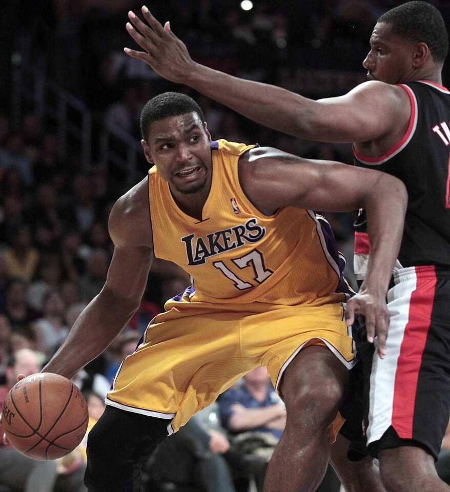 Lakers center Andrew Bynum, who finished with 28 points and nine rebounds, works his way around Blazers power forward Kurt Thomas in the second half Friday night at Staples Center.