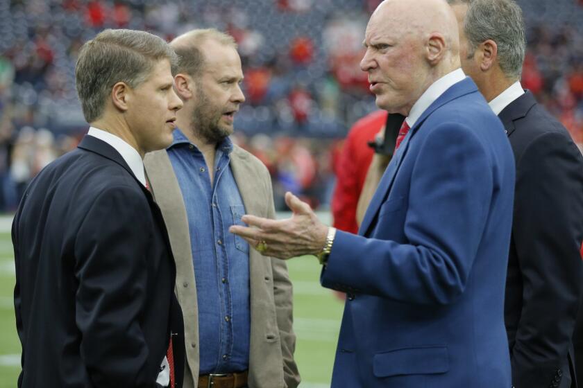 Kansas City Chiefs CEO Clark Hunt, left, and Houston Texans owner Bob McNair, right, are members of the committee.
