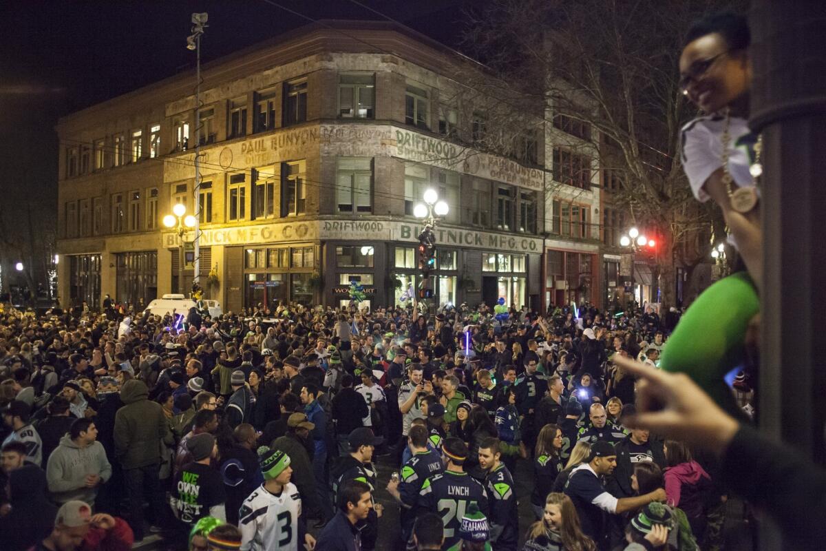 Seattle Seahawks fans celebrate in Seattle after watching their team win the Super Bowl.