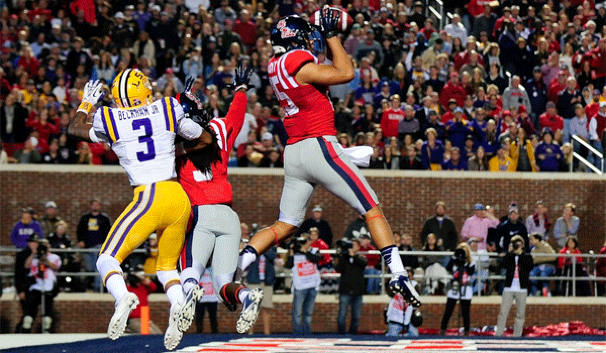 Mississippi's Cody Prewitt intercepts a pass intended for LSU's Odell Beckham Jr. during the Rebels' 27-24 victory on Saturday.