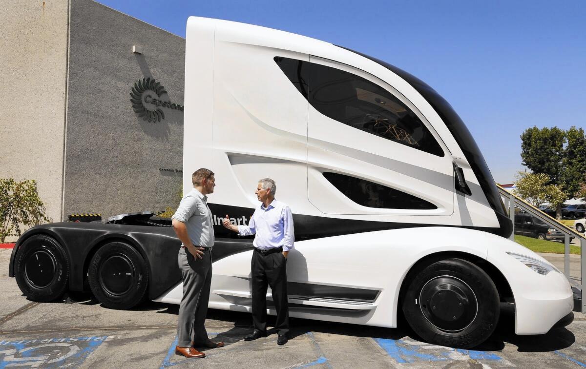 A futuristic hybrid-electric tractor-trailer concept truck is parked outside the Capstone Turbine facility in Chatsworth.