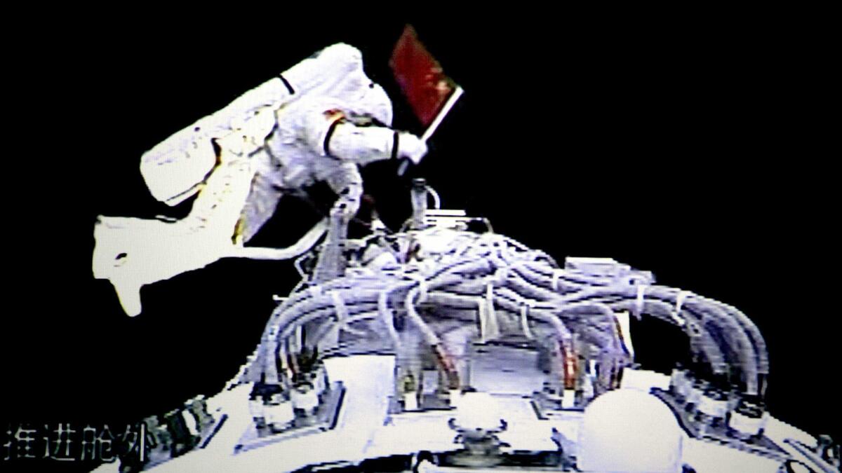 In this video grab taken at the Beijing Space Command and Control Center released by China's Xinhua News Agency, Saturday, Sept. 27, 2008, Chinese astronaut Zhai Zhigang walks outside the orbit module of the Shenzhou7 spacecraft for a spacewalk. (AP Photo/Xinhua)
