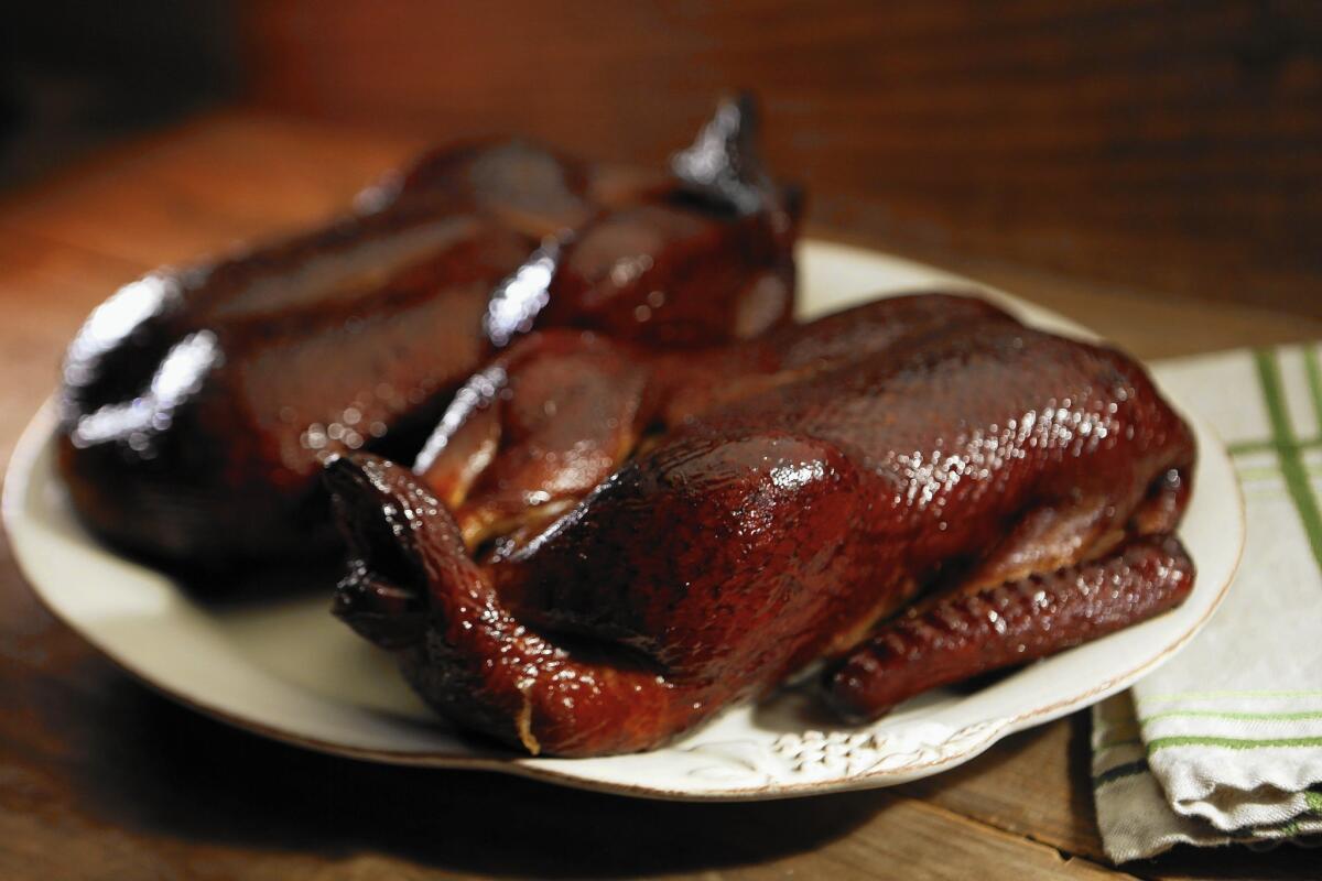 Maple-bourbon smoked duck achieves a rich coloring. Get the recipe.