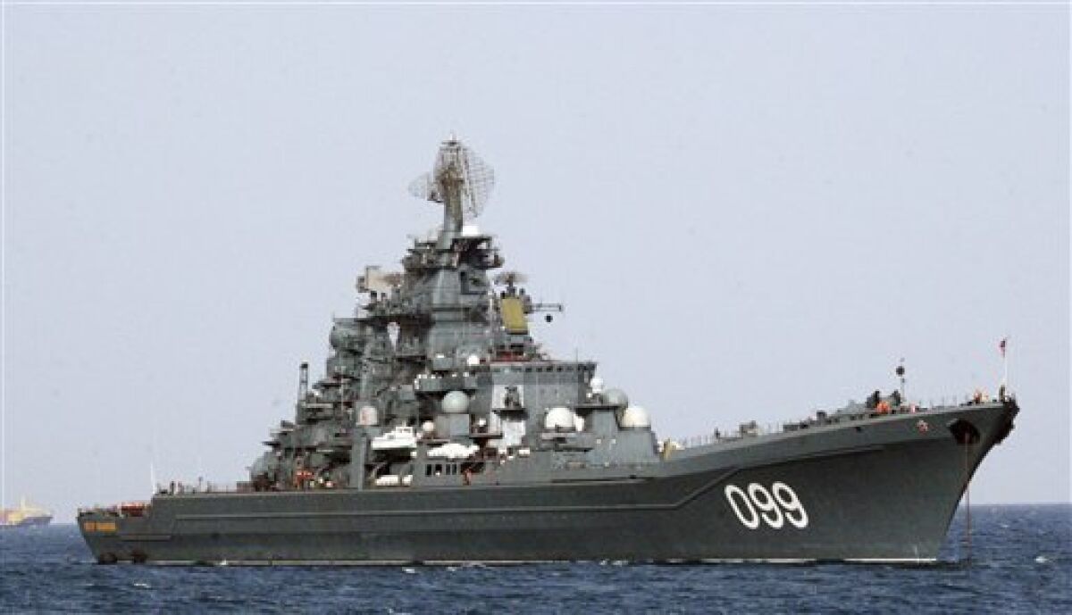 In this Oct. 13, 2008 file photo the Russian nuclear-powered cruiser Pyotr Veliky (Peter the Great), one of the three Russian warships, sails near the Libyan port of Tripoli, Libya, following a two-day stop on their way to Latin America to take part in joint naval exercises with Venezuela. The voyage of the cruiser Peter the Great, scheduled to arrive in Venezuela next week with a squadron of other Russian warships, was meant to showcase the Kremlin's ability to project naval power abroad and reassert its claim to great power status. (AP Photo/Abdel Magid Al Fergany, File)