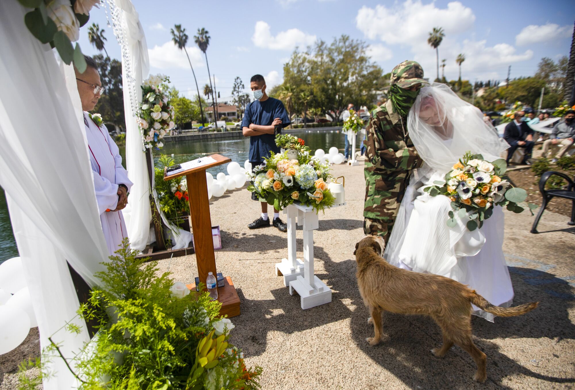 March 20: A homeless couple gets married at the Echo Park encampment with a dog nearby.