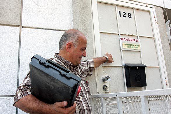 Los Angeles County environmental health specialist Sarkis Kharadjian knocks at the manager's door of an apartment building in the Panorama City area of Los Angeles in an unannounced inspection of its swimming pool.