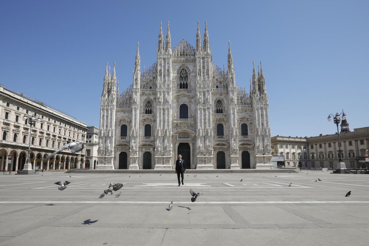 Andrea Bocelli stands in the empty plaza in front of the Duomo di Milano on Easter Sunday