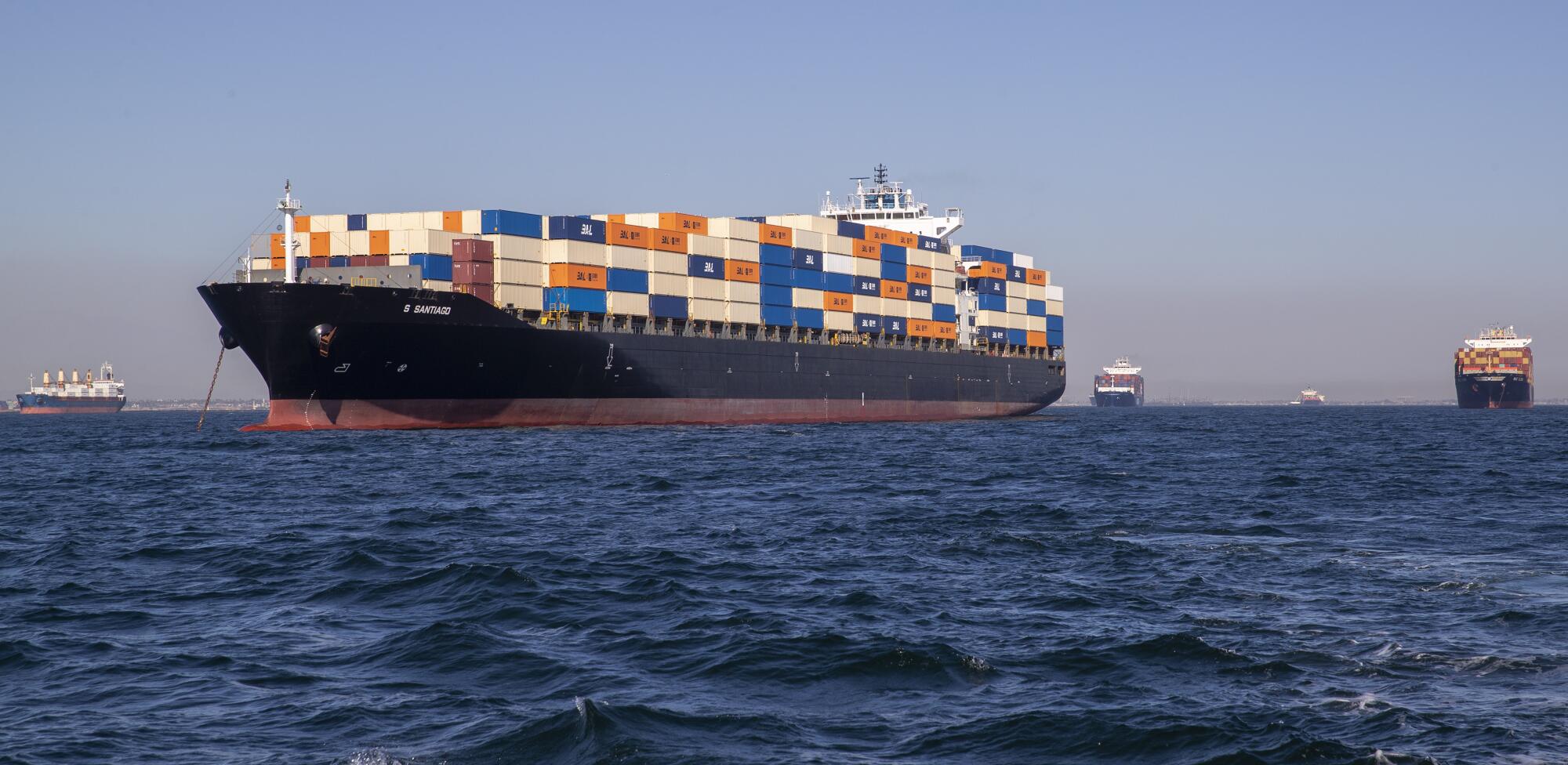 Cargo ships anchored at sea