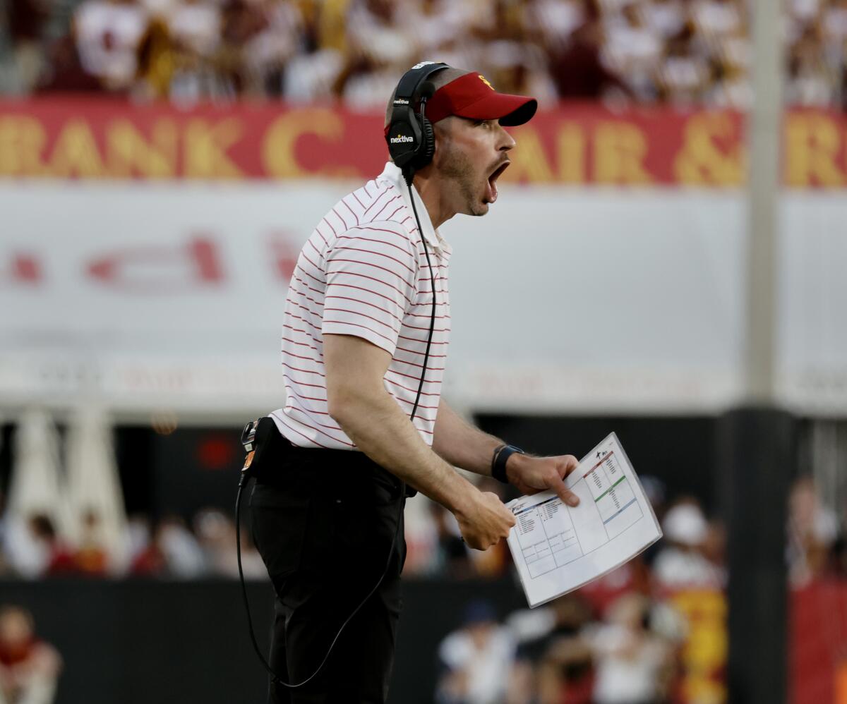 USC defensive coordinator Alex Grinch yells at the defense during a 52-42 loss to Washington at the Coliseum.