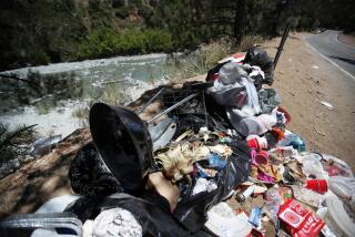 San Gabriel Mountains National Monument, CA - July 26: Trash piles up along the East Fork of the San Gabriel River in the San Gabriel Mountains National Monument in the Angeles National Forest Wednesday, July 26, 2023. Nine years after then President Obama upgraded Southern California's mountainous backyard to national monument status, with a promise of a cleaner and safer wilderness within an hour's drive of 18 million people, it is anything but. (Allen J. Schaben / Los Angeles Times)