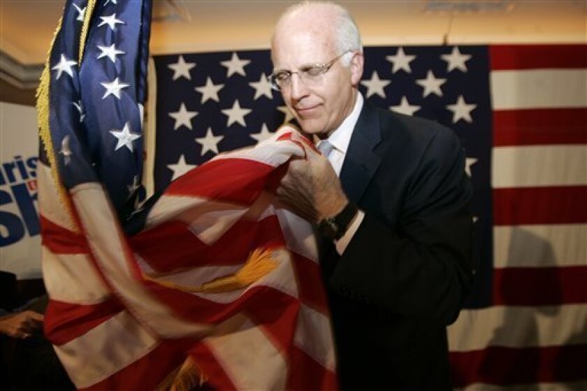 As he left the podium, U.S. Rep. Christopher Shays, R-Conn., picked up the large American flag , briefly held it and then left the podium in Norwalk, Conn., Tuesday, Nov. 4, 2008 after making his concession speech. Shays was defeated by Democratic challenger Jim Himes. (AP Photo/Bob Child)