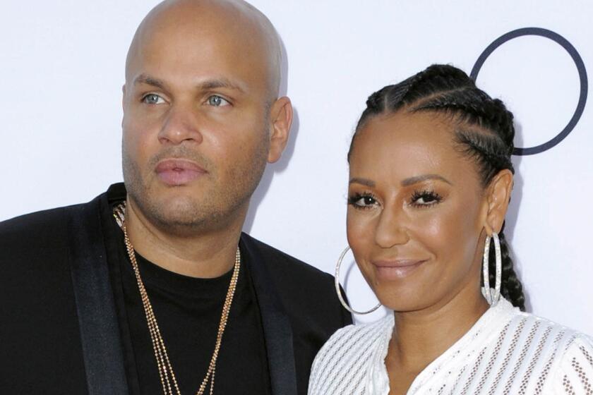 Stephen Belafonte and Melanie "Mel B" Brown arrive at the premiere of "Mother's Day" in L.A. on April 13, 2016.