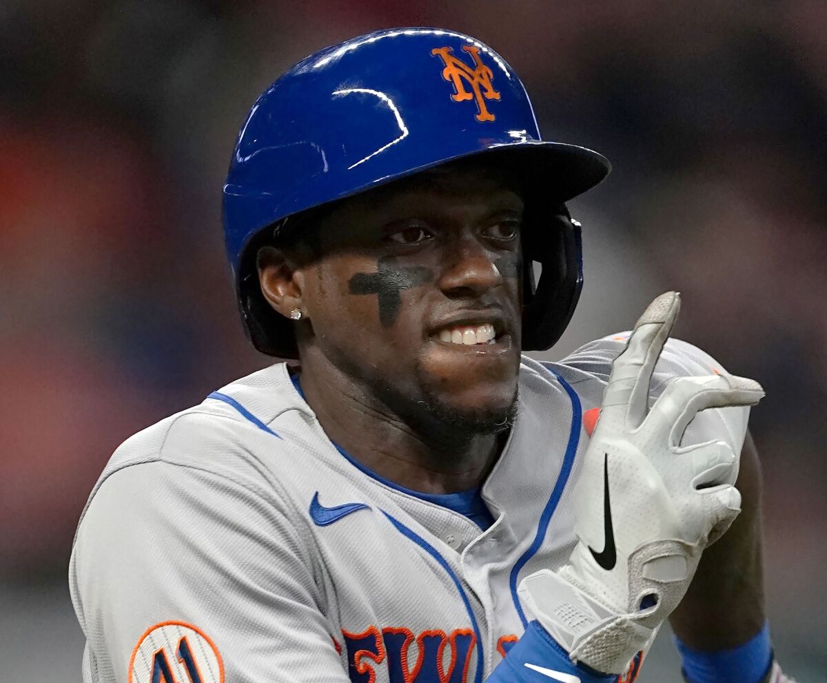 FILE - New York Mets' Cameron Maybin advances to first base on a dropped third strike in the ninth inning of a baseball game against the Atlanta Braves, May 19, 2021, in Atlanta. Maybin is retiring after 15 major league seasons. The 34-year-old hit .036 with no RBIs in 28 at-bats from May 19-29 last season for the Mets. (AP Photo/John Bazemore, File)
