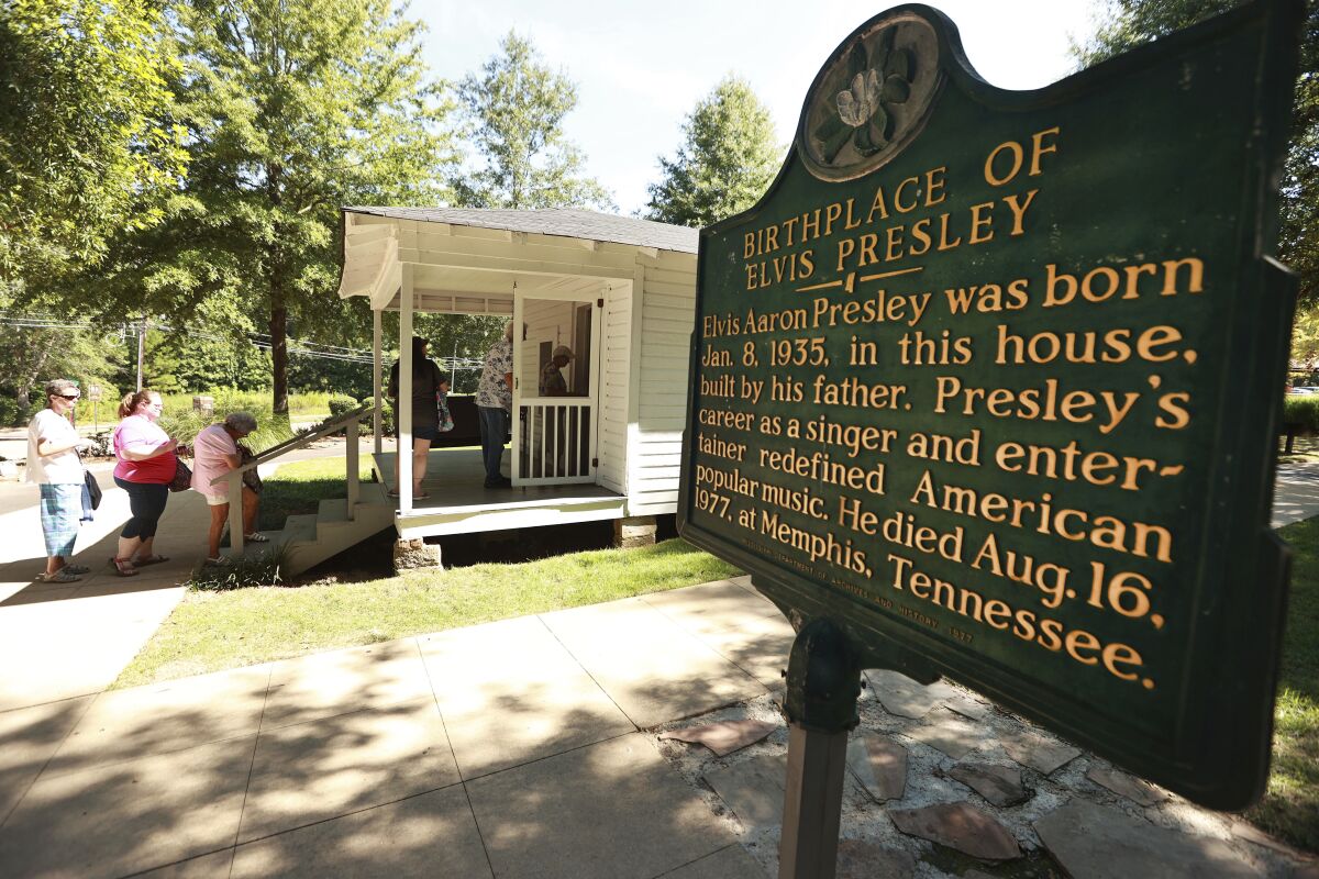 Elvis fans tour the Elvis Presley Birthplace on Saturday morning, Aug. 13, 2022, in Tupelo, Miss., for Elvis Fan Appreciation Day. (Adam Robison/The Northeast Mississippi Daily Journal via AP)
