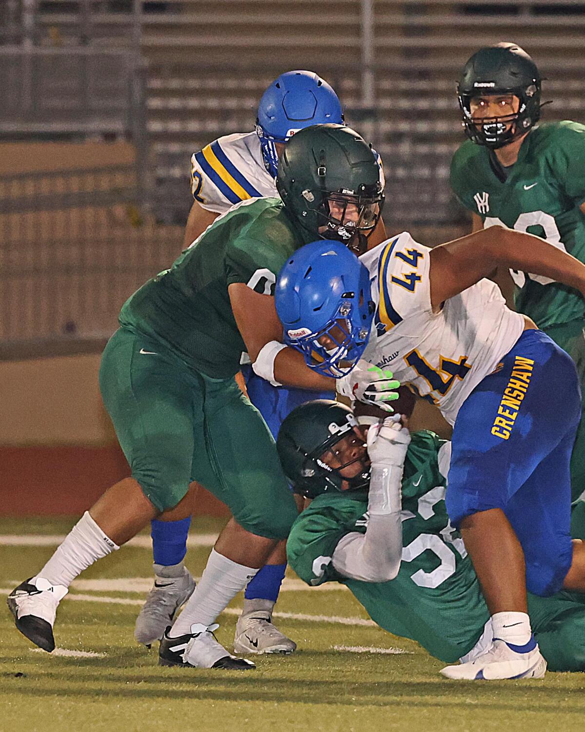 Samuel Richard of Crenshaw (44) rushed for 144 yards in 8-6 win over Hamilton.