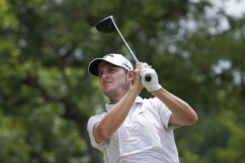 Emiliano Grillo, of Argentina, hits a tee shot on the second hole during the final round of the Charles Schwab Challenge golf tournament at Colonial Country Club in Fort Worth, Texas, Sunday, May 28, 2023. (AP Photo/LM Otero)