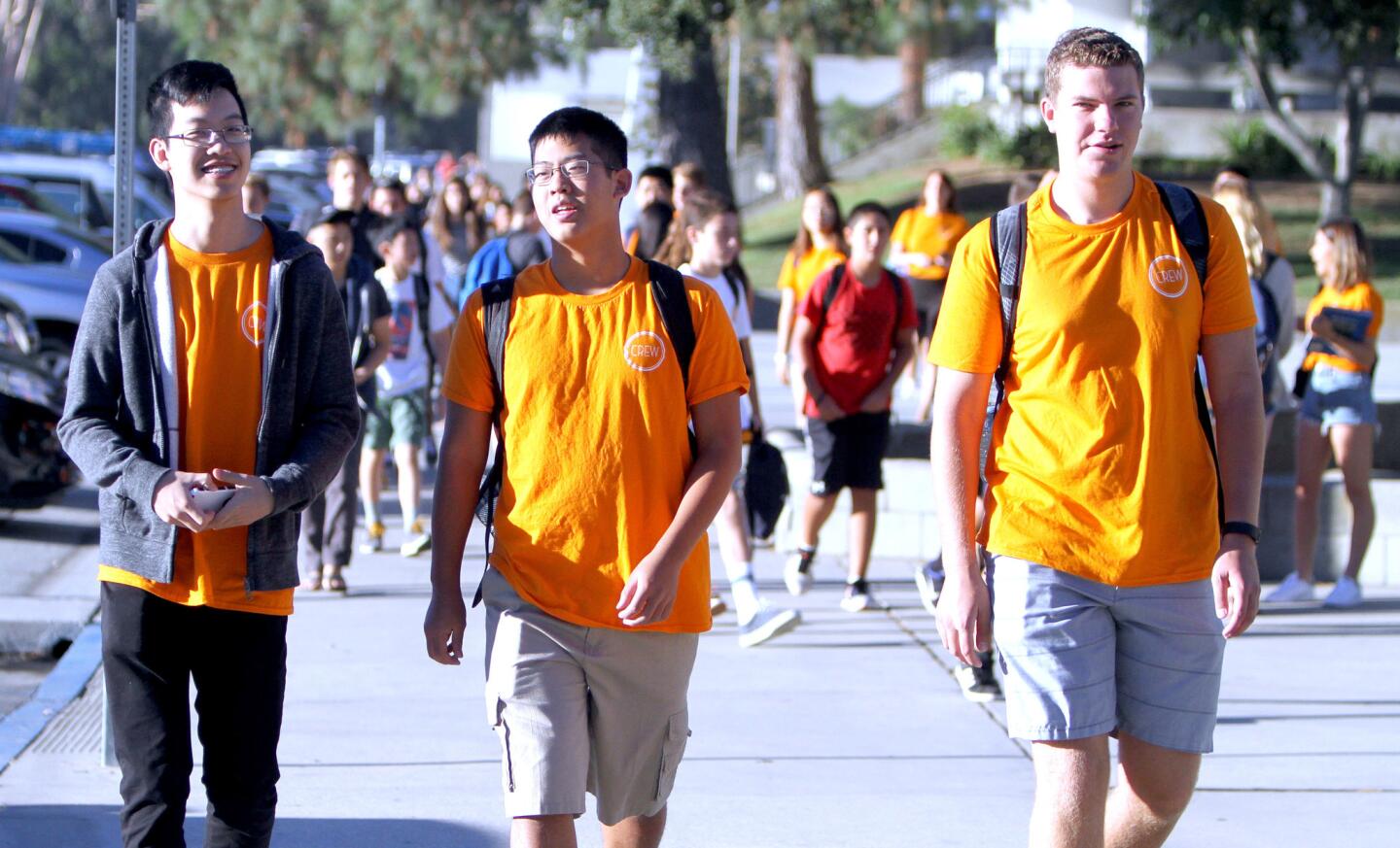 La Cañada High School seniors and members of the school's Link Crew Freshmen Mentorship Program, from left, Jesper Ploysangngam, Johnny Wang and Andrew Gray arrive for the first day of school at the La Cañada Flintridge high school on Tuesday, August 16, 2016.