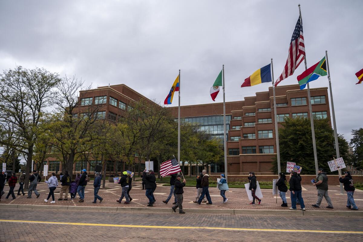 Union members and supporters gather during a rally outside Kellogg's headquarters.