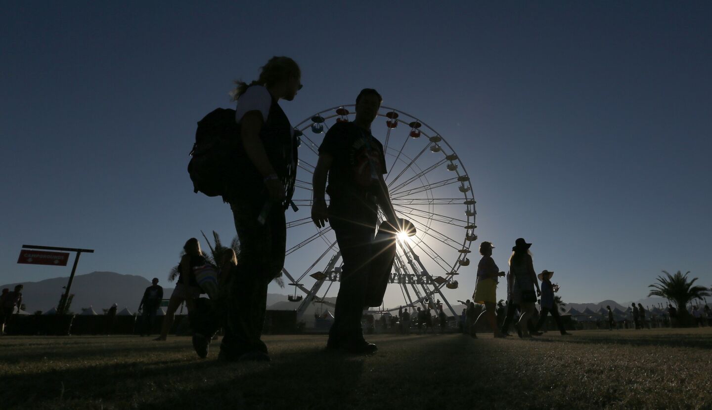 Concert-goers wander the Empire Polo Grounds in Indio as gates open for Desert Trip's second weekend.
