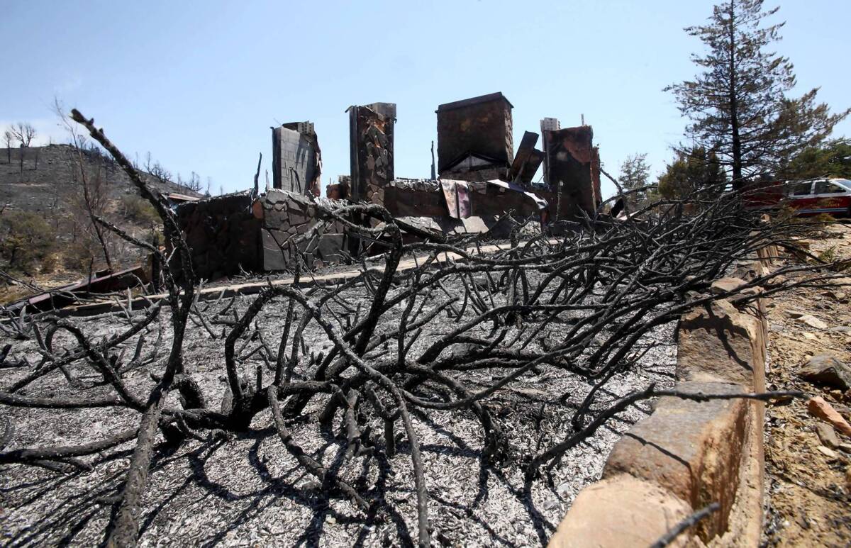 A burned home in Peeples Valley, Ariz., near where 19 firefighters died battling the blaze.