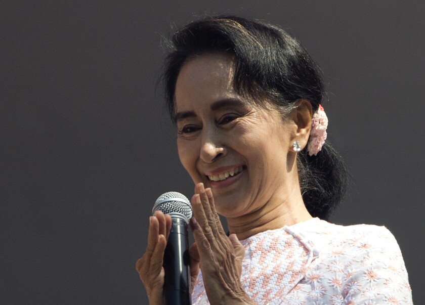 As early election results come in, Myanmar opposition leader Aung San Suu Kyi delivers a speech from her party headquarers in Yangon on Nov. 9.