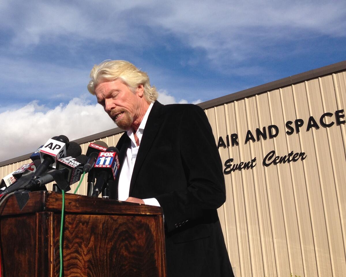 Billionaire Virgin Galactic founder Richard Branson speaks to reporters in Mojave on Saturday, a day after the crash of his company's prototype space tourism rocket.
