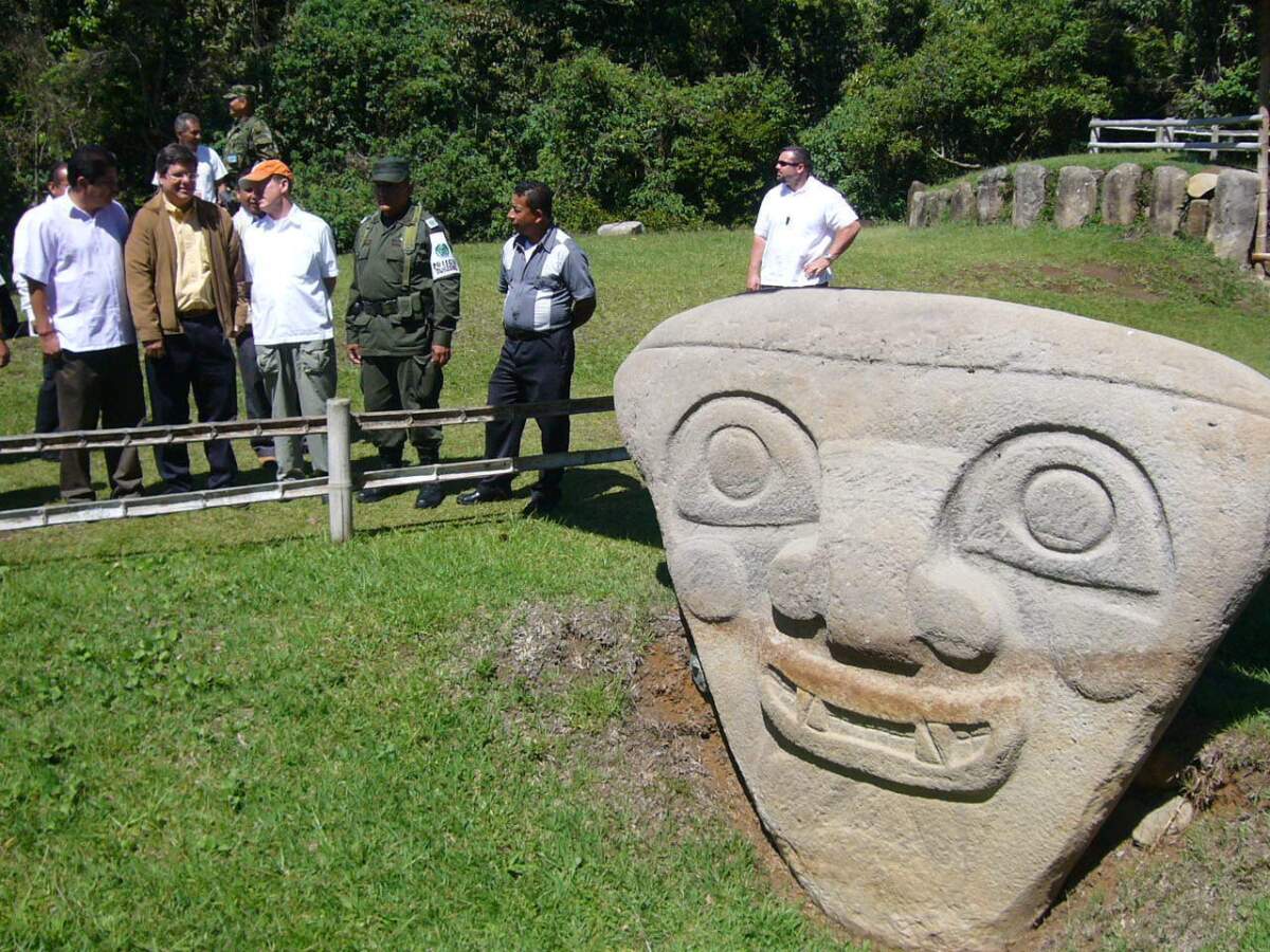 People gather near a statue in the San Agustin archaeological park in southern Colombia. Residents blocked the removal of 20 statues that were to have been displayed in a show in Bogota, the capital, causing the exhibit's cancellation.