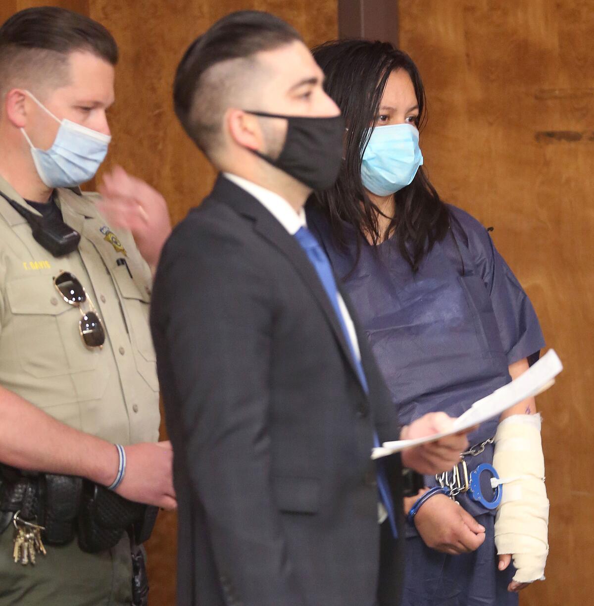 Deputy Public Defender Brandon Mata with Liliana Carrillo during her arraignment in Kern County Superior Court on Wednesday.