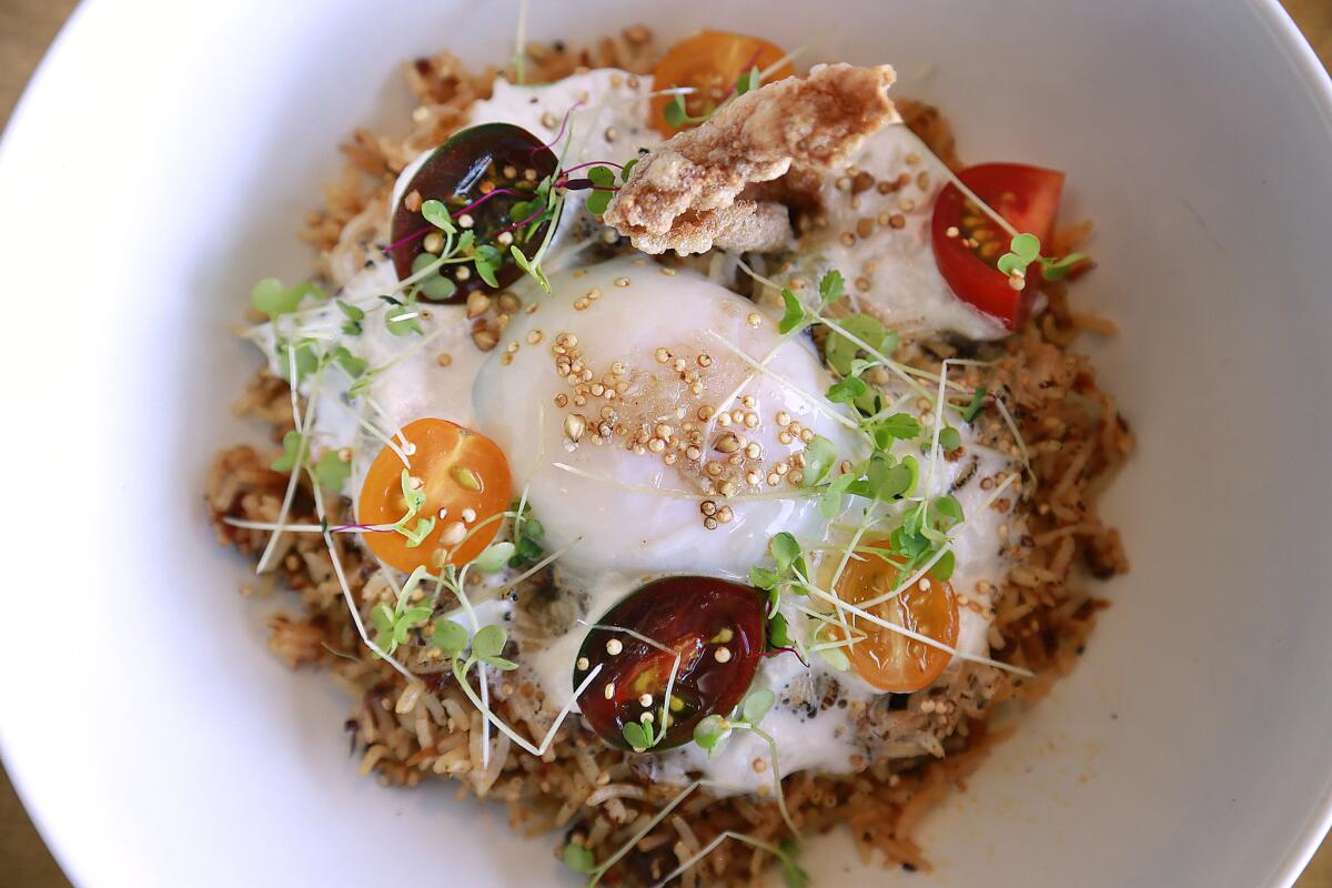 The Baroo dish known as Asian Fever consists of Amira basmati rice, southeast Asian inspired housemade mix, lemongrass and coconut foam with sake lees, crispy shrimp chips, heirloom cherry tomatoes and lime supreme.