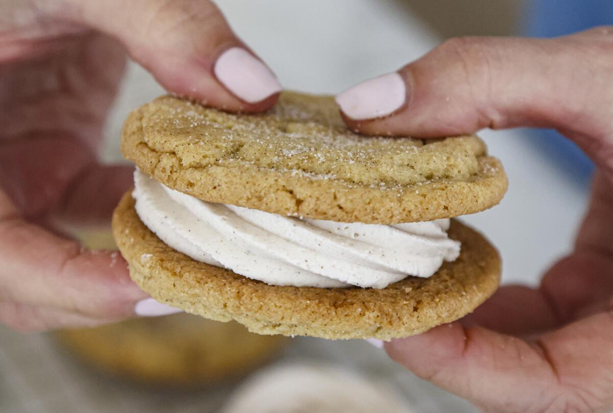 Chai spice buttercream filling between two snickerdoodle cookies.