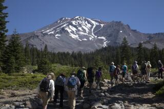 MT. SHASTA, CA - July 16: A group sets out to hike one of the many trails at Mt. Shasta. On June 6, five climbers fell on the mountain's icy surface resulting in the death of a mountain guide. On average, there are 10 rescues and one fatality each year. Photographed on Friday, July 15, 2022 in Mt. Shasta, Siskiyou County CA. (Myung J. Chun / Los Angeles Times)