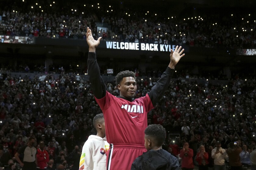 Miami Heat guard Kyle Lowry acknowledges the crowd before the team's NBA basketball game against the Toronto Raptors, Sunday, April 3, 2022, in Toronto. (Nathan Denette/The Canadian Press via AP)